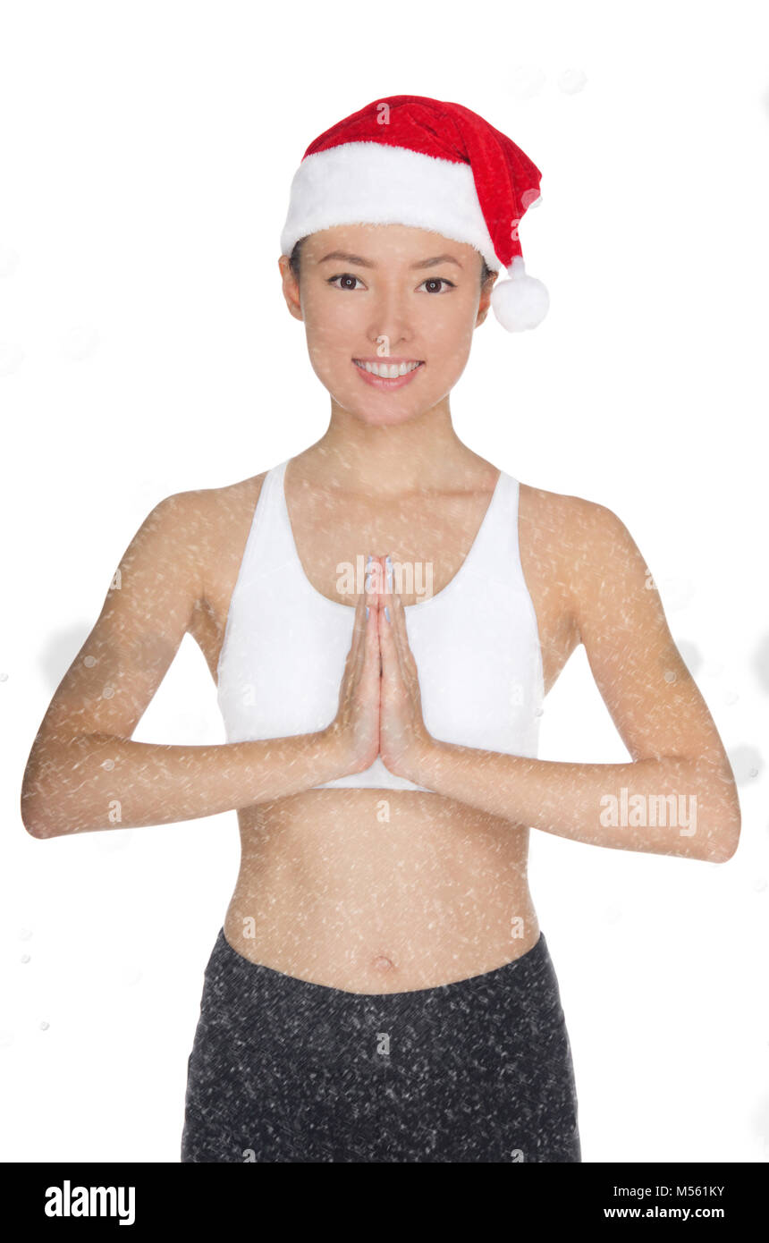 Asiatische Frau in Santa Claus Kostüm ist in der Fitness eingerückt Stockfoto