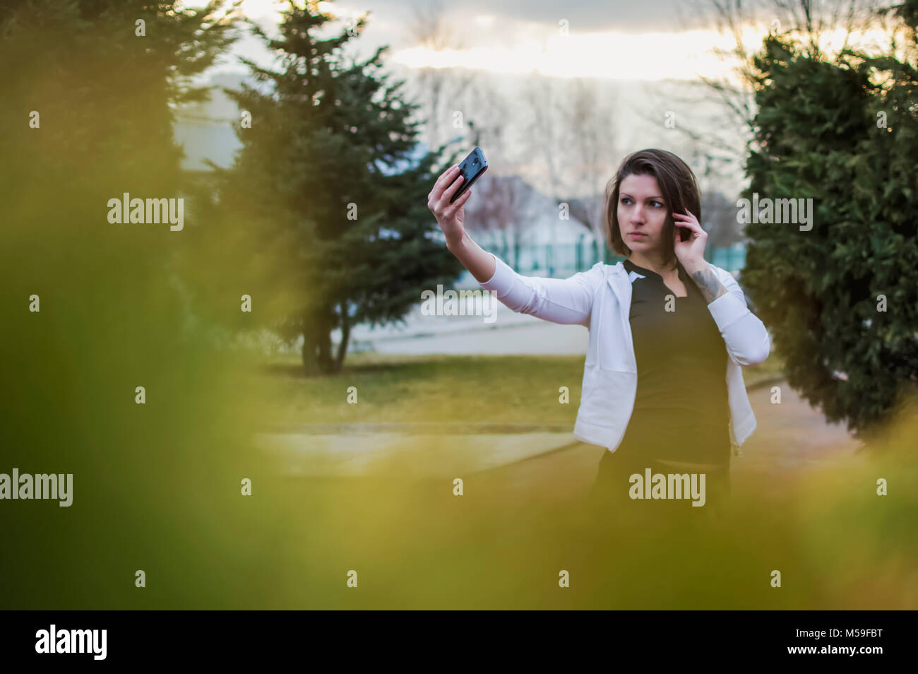 Sportlerin ein selfie bei Sonnenuntergang Stockfoto