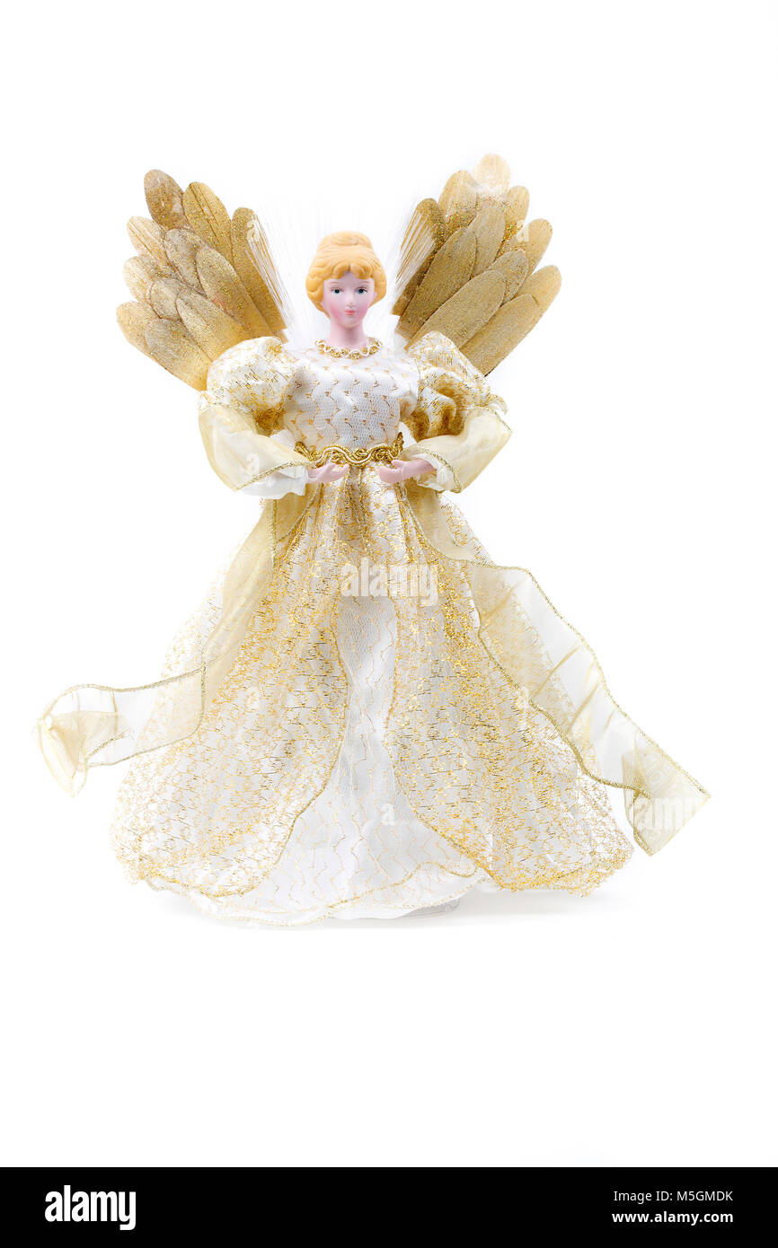 Puppe in einem goldenen Kleid auf weißem Hintergrund Stockfoto