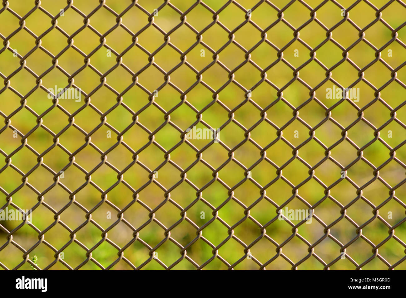 Maschendrahtzaun closeup Abstrakt Hintergrund. Stockfoto