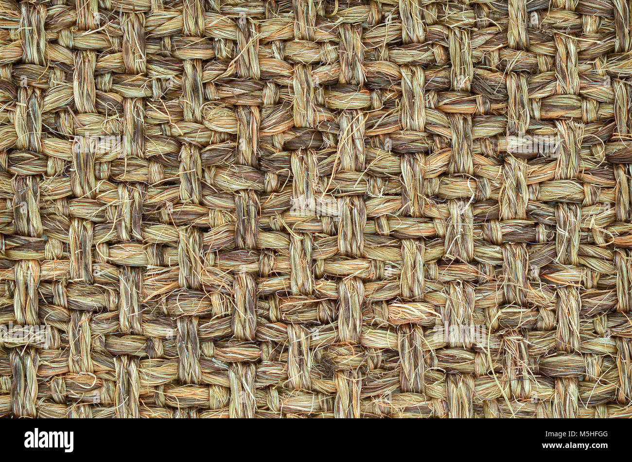 Nahaufnahme von Hand gewebt / gebunden Wolldecke Detail, gemusterten Sisal, Hanf Hintergrund Textur. Stockfoto