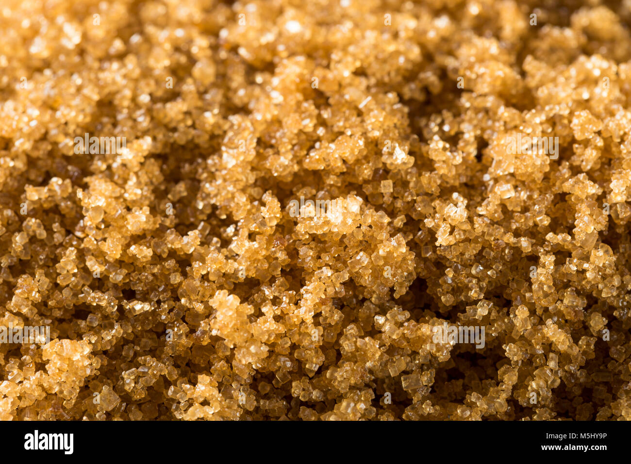 Raw Organic Light Brown Sugar in einem Stapel Stockfoto