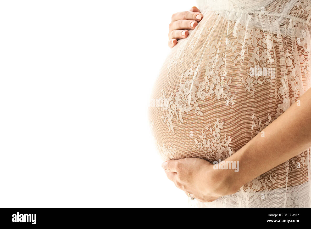 Schöne Erwachsene schwangere Frau. Warten auf das Baby. Schwangerschaft. Pflege, Zärtlichkeit Mutterschaft. Weißer Hintergrund Stockfoto