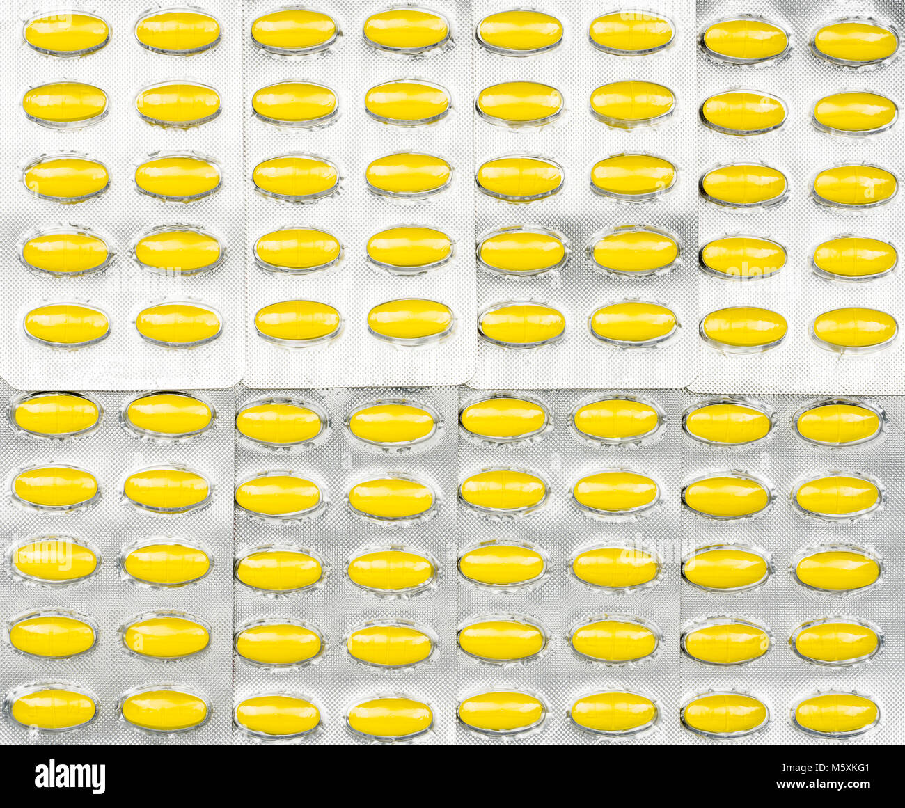 Full Frame von ovalen gelben Tabletten Tabletten in Blisterpackungen. Gelbe pillen Muster Tapete. Mefenamic acid Tabletten Pillen für Entlastung schmerzen, Krämpfe, Stockfoto