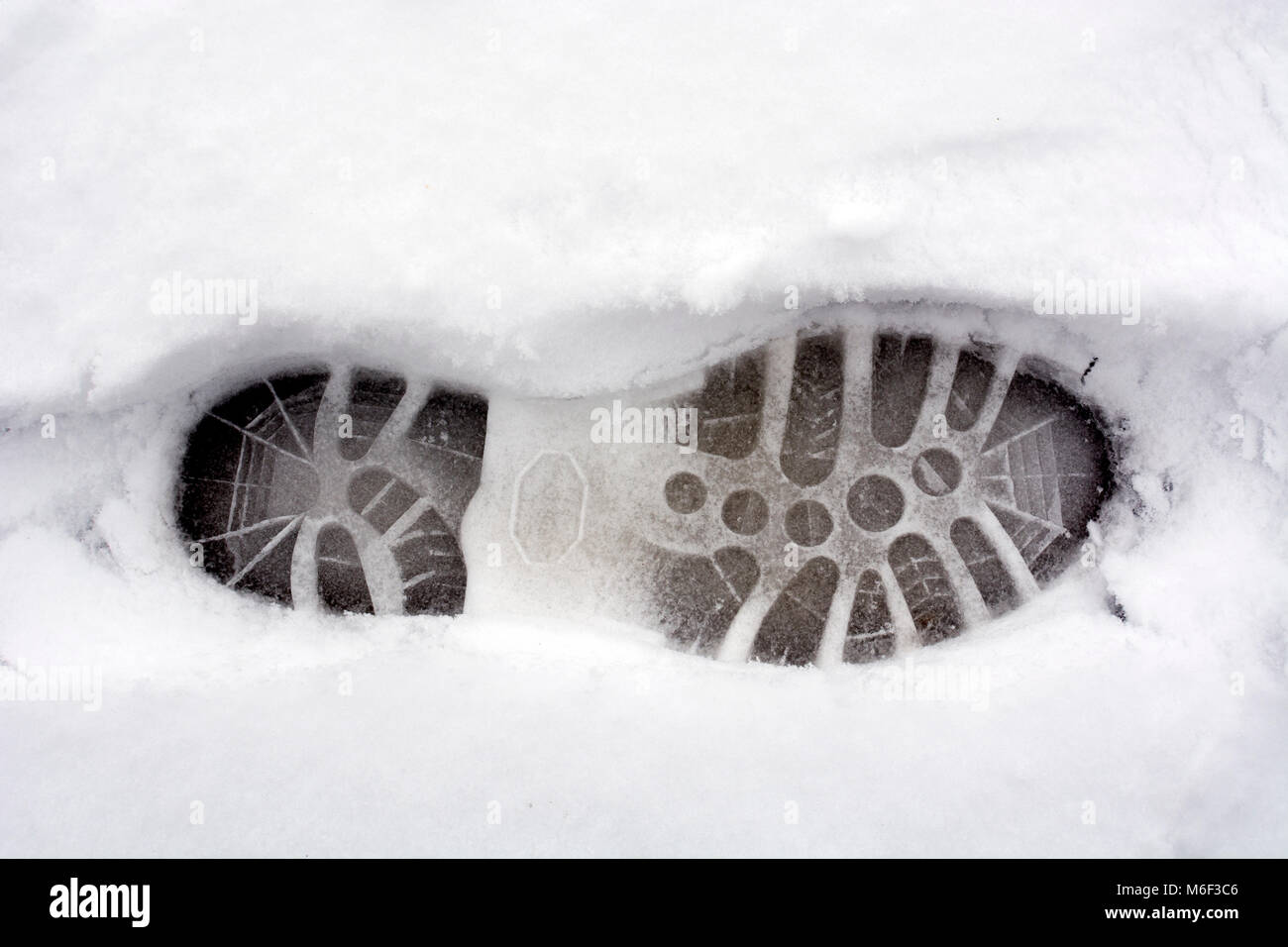 Zu Fuß Boot Footprint im Schnee Stockfoto