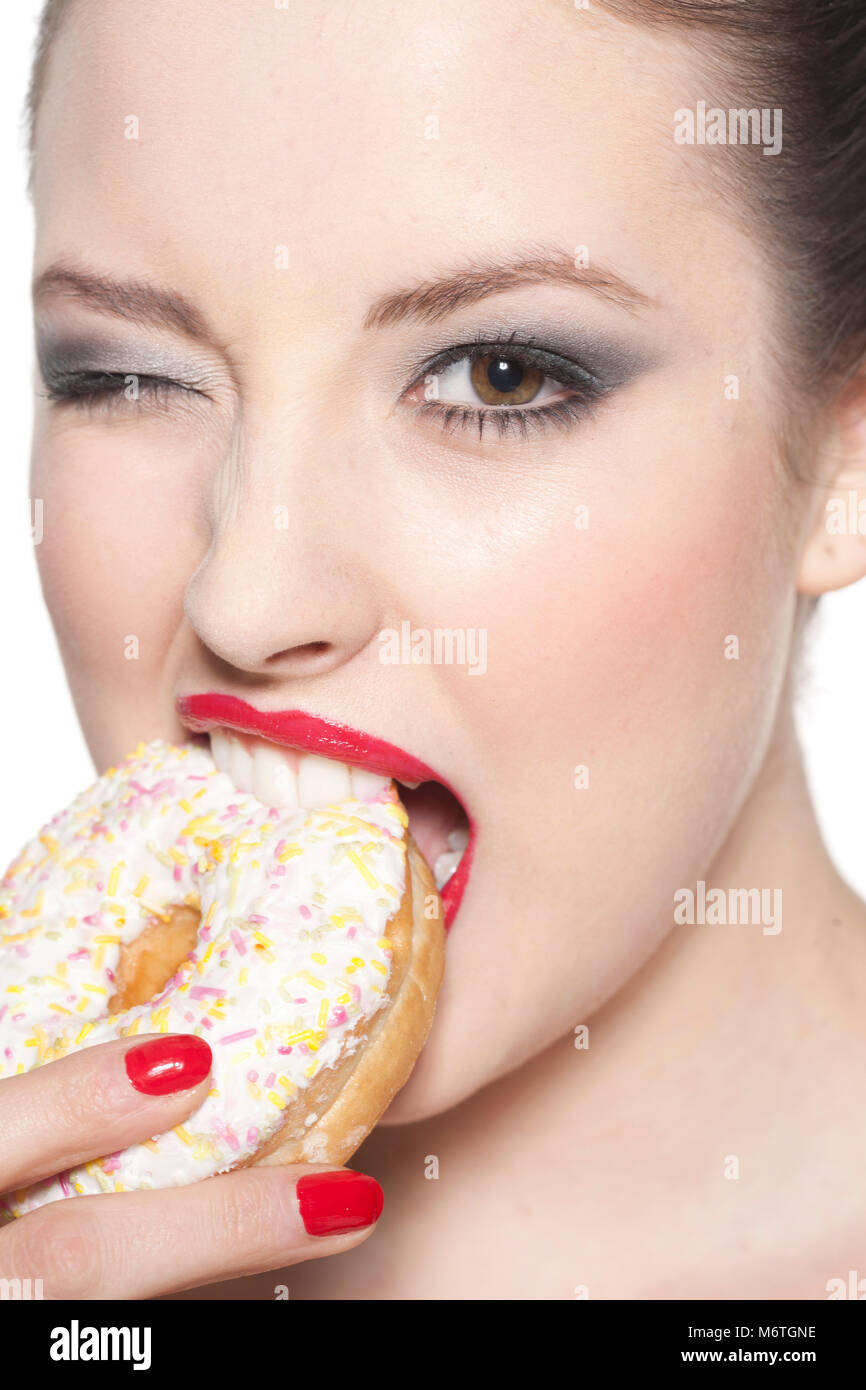 Frau Essen Donut Stockfoto