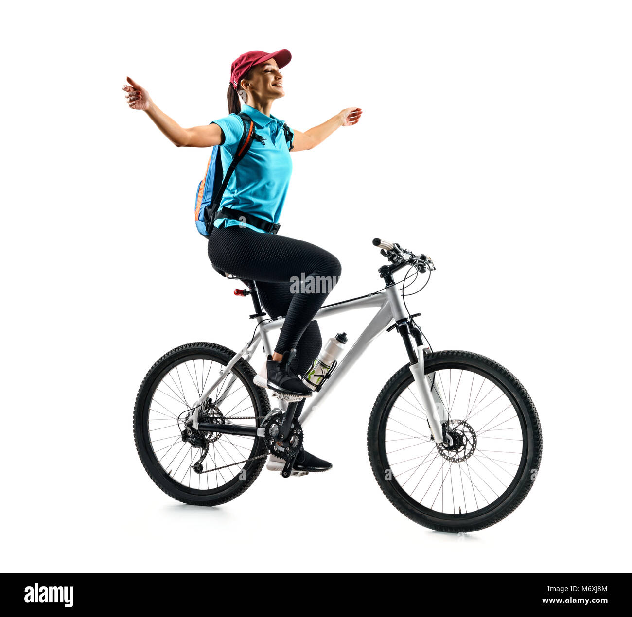 Radfahrer in blauen T-Shirt, das Fahrrad in Silhouette auf weißem Hintergrund. Dynamische Bewegung. Sport und eine gesunde Lebensweise Stockfoto