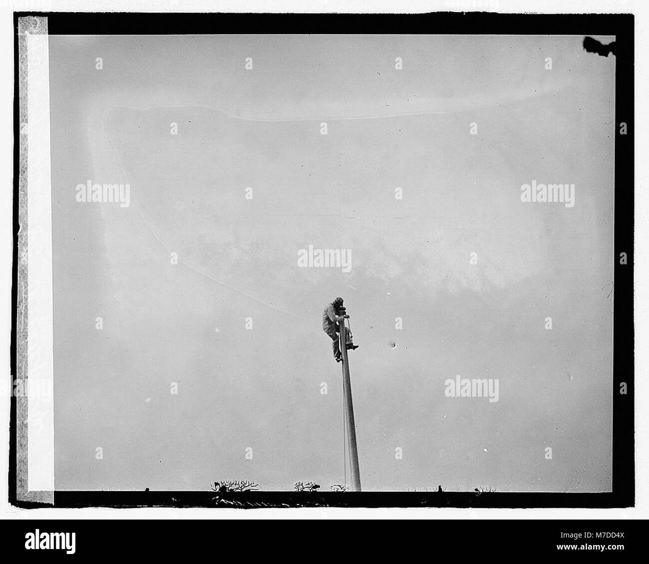 Ein Porträt von S.E. Kellian, einem Turmjäger, der den Beruf des Einzelnen im frühen 20. Jahrhundert zeigt. Das Bild zeigt die einzigartige Arbeit und die Fähigkeiten, die mit diesem gefährlichen Beruf verbunden sind. Stockfoto