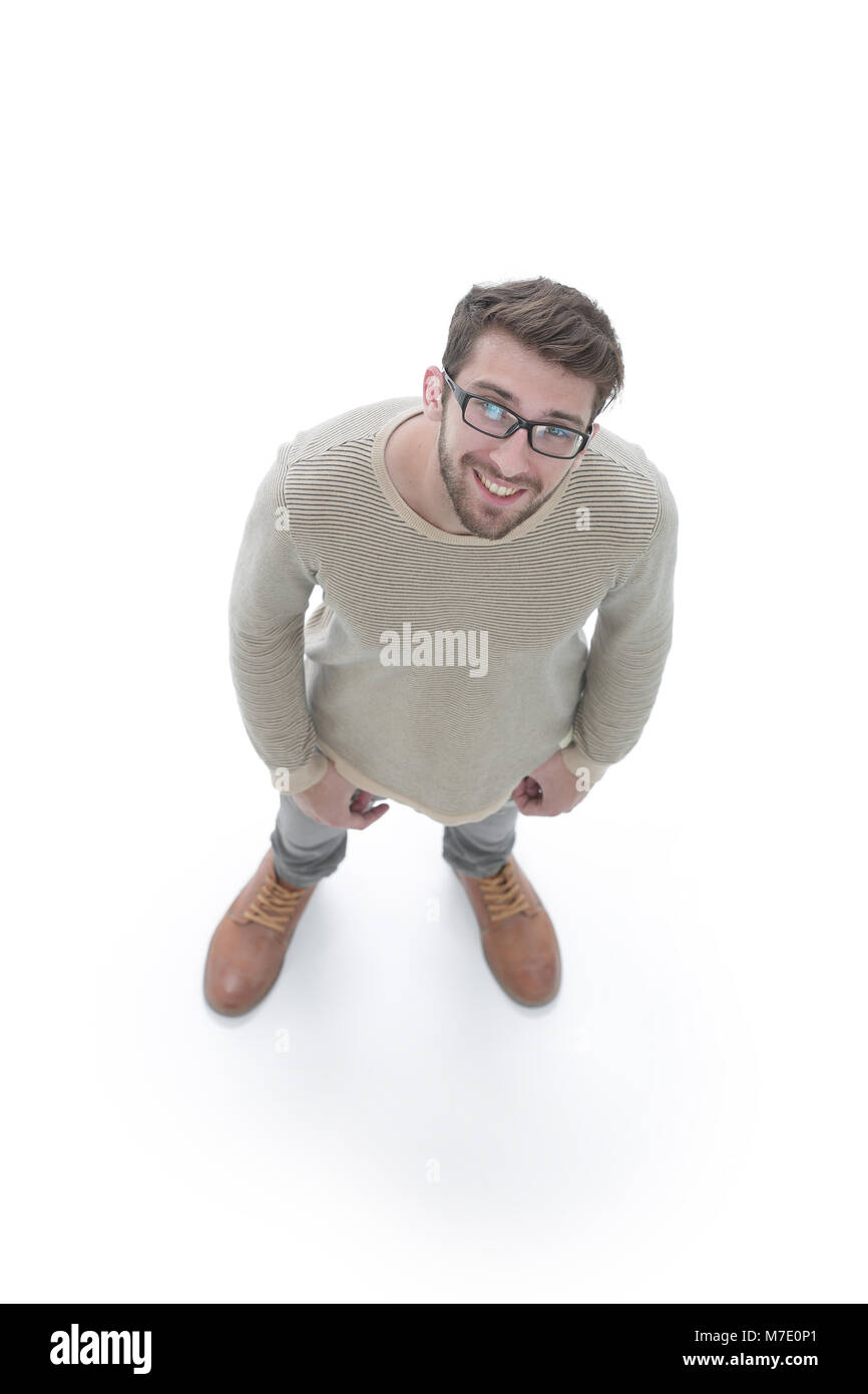 Blick von oben. Ernsthafte junge Mann an der Kamera schaut. Stockfoto