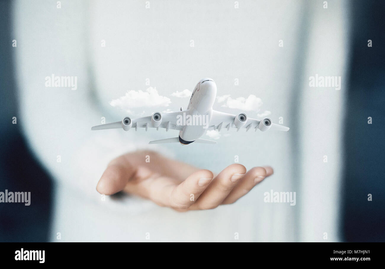 Flugzeug auf Hand, Konzept der Urlaub oder Business arbeiten Stockfoto
