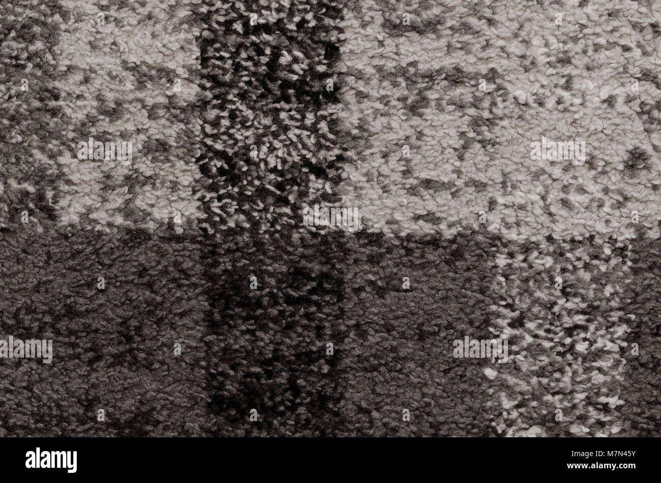 Grauer Teppich muster textur. Teppich Textur Stoff wolle Fußmatte Textil grau Konzept Stockfoto