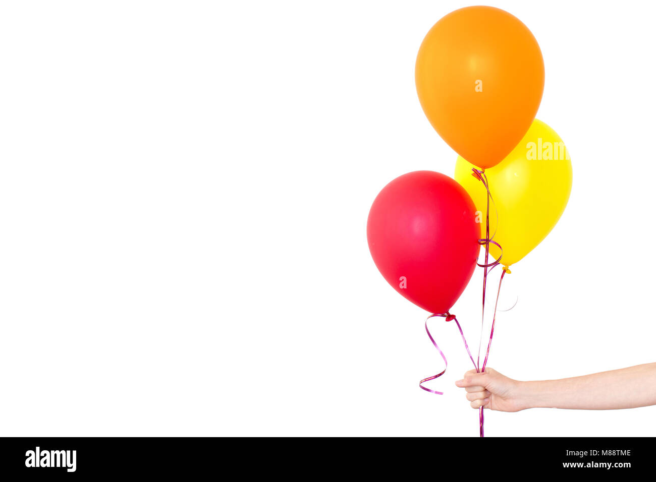 Womans Hand hält Luftballons in einem weißen Hintergrund Stockfoto