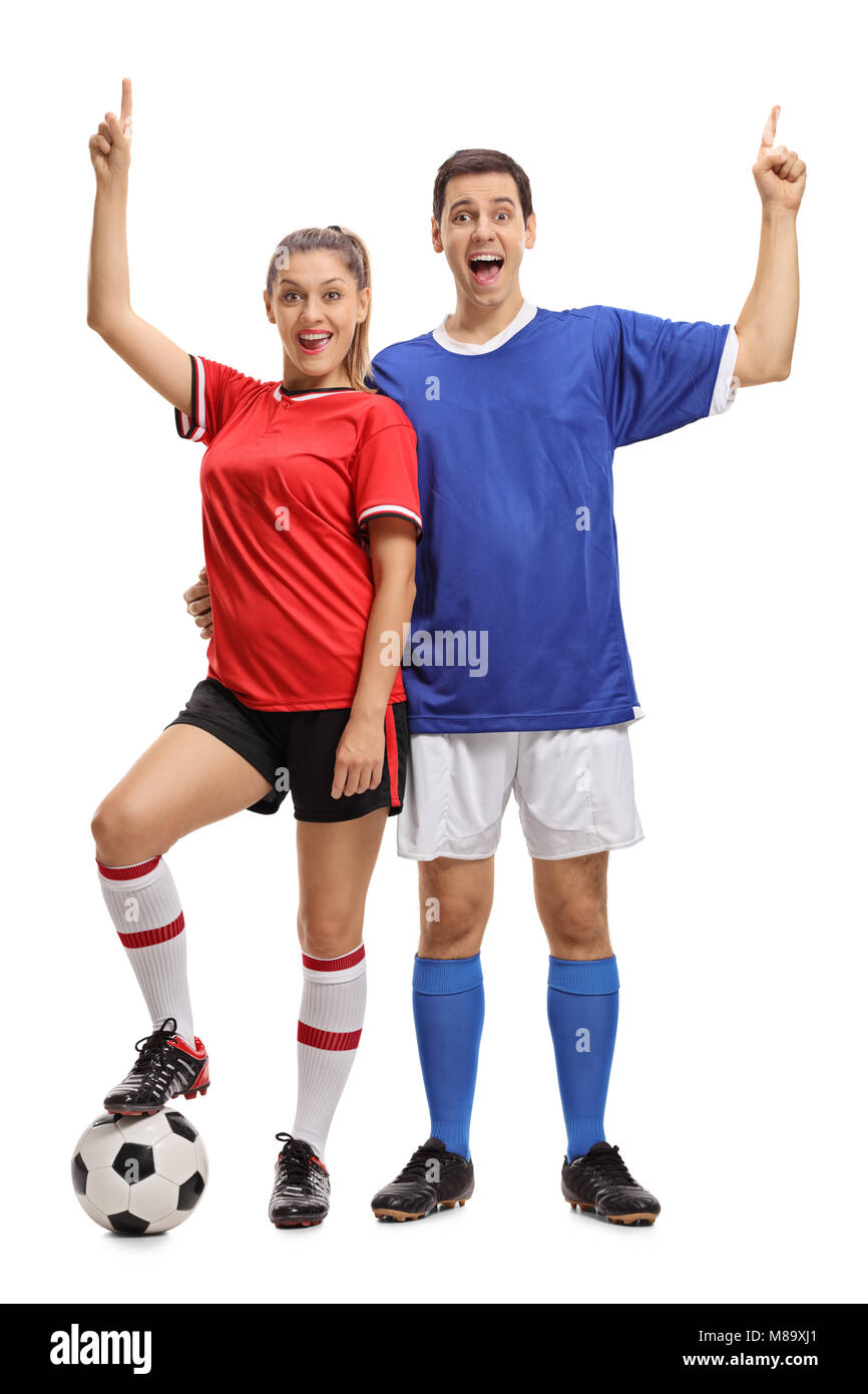 In voller Länge Porträt einer jungen fröhlichen Paar mit einem Fußball in Sportkleidung halten Sie Ihren Zeigefinger auf weißem Hintergrund gekleidet Stockfoto