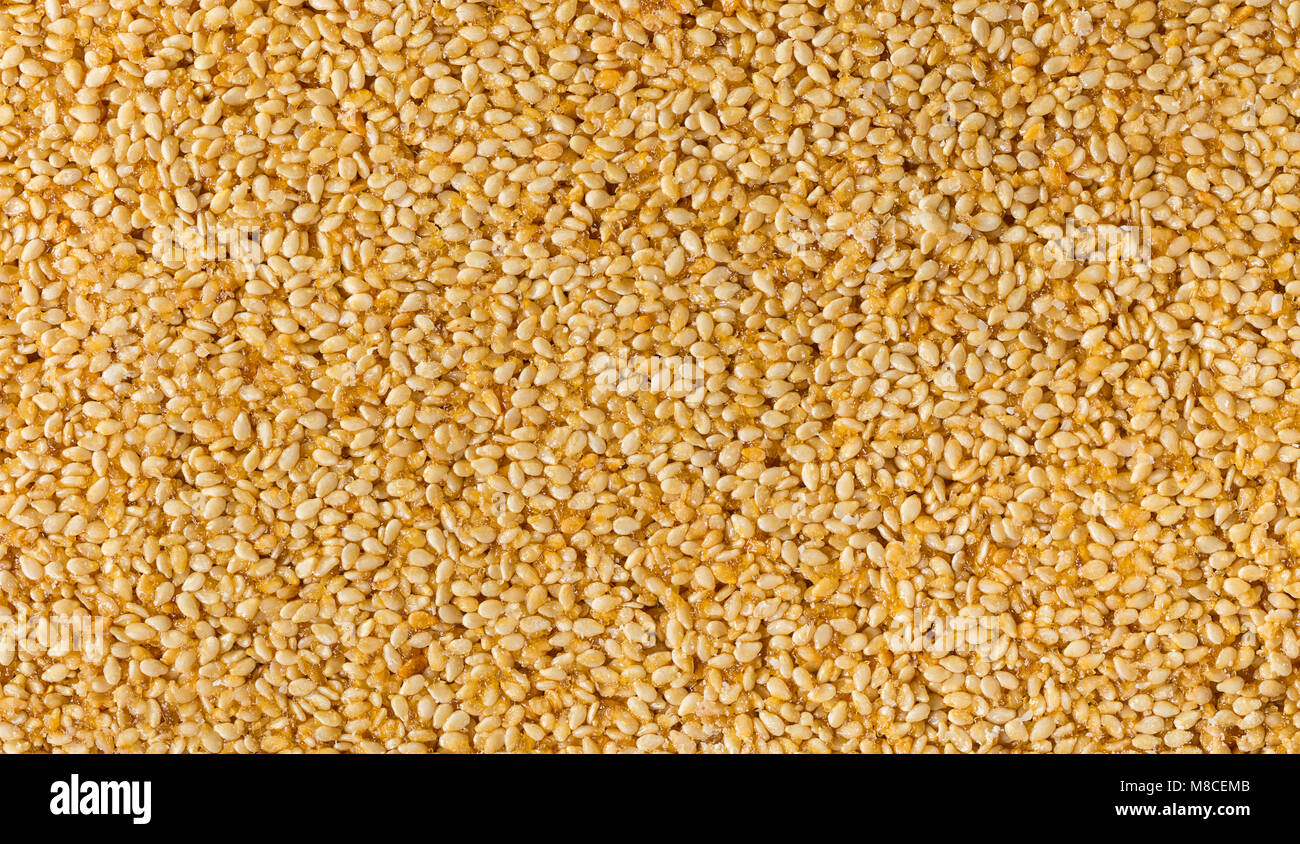 Essen Hintergrund Textur von Sesam in Karamell close-up Stockfoto