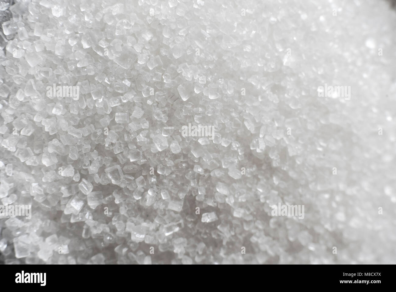 Weißzucker Textur und Hintergrund Stockfoto