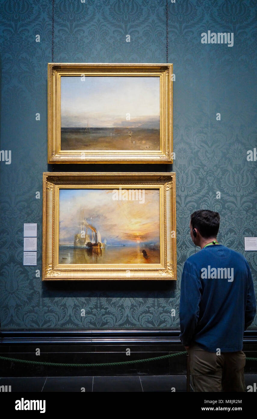 London, Großbritannien - 30 Dez 2017: ein Besucher des Londoner National Gallery beobachtet Joseph Mallord William Turner's berühmten Öl Gemälde "Der Kampf Temeraires'. Stockfoto