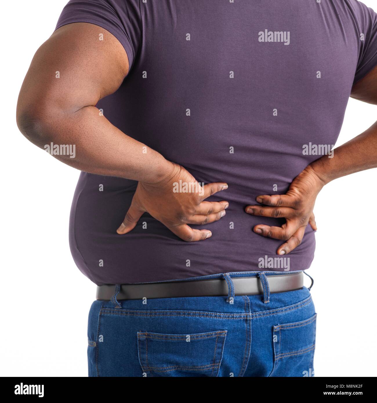 Übergewichtige Menschen mit den Händen auf dem Rücken. Stockfoto