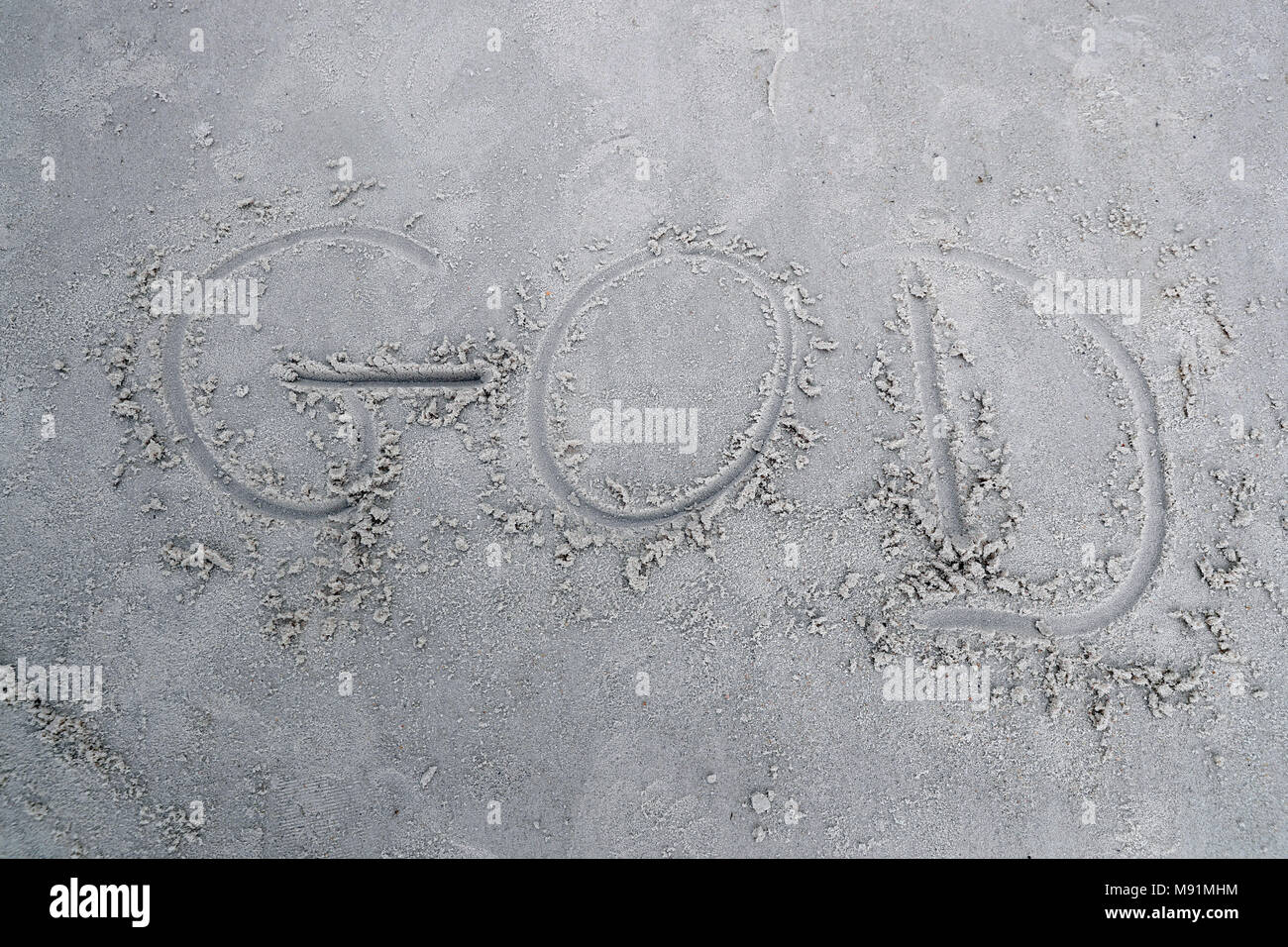 Gottes Wort in Sand am Strand. Stockfoto