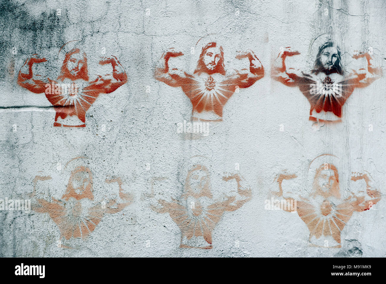 Stenciled Bild von Jesus Christus auf eine Wand. Karikatur. Hanoi. Vietnam. Stockfoto
