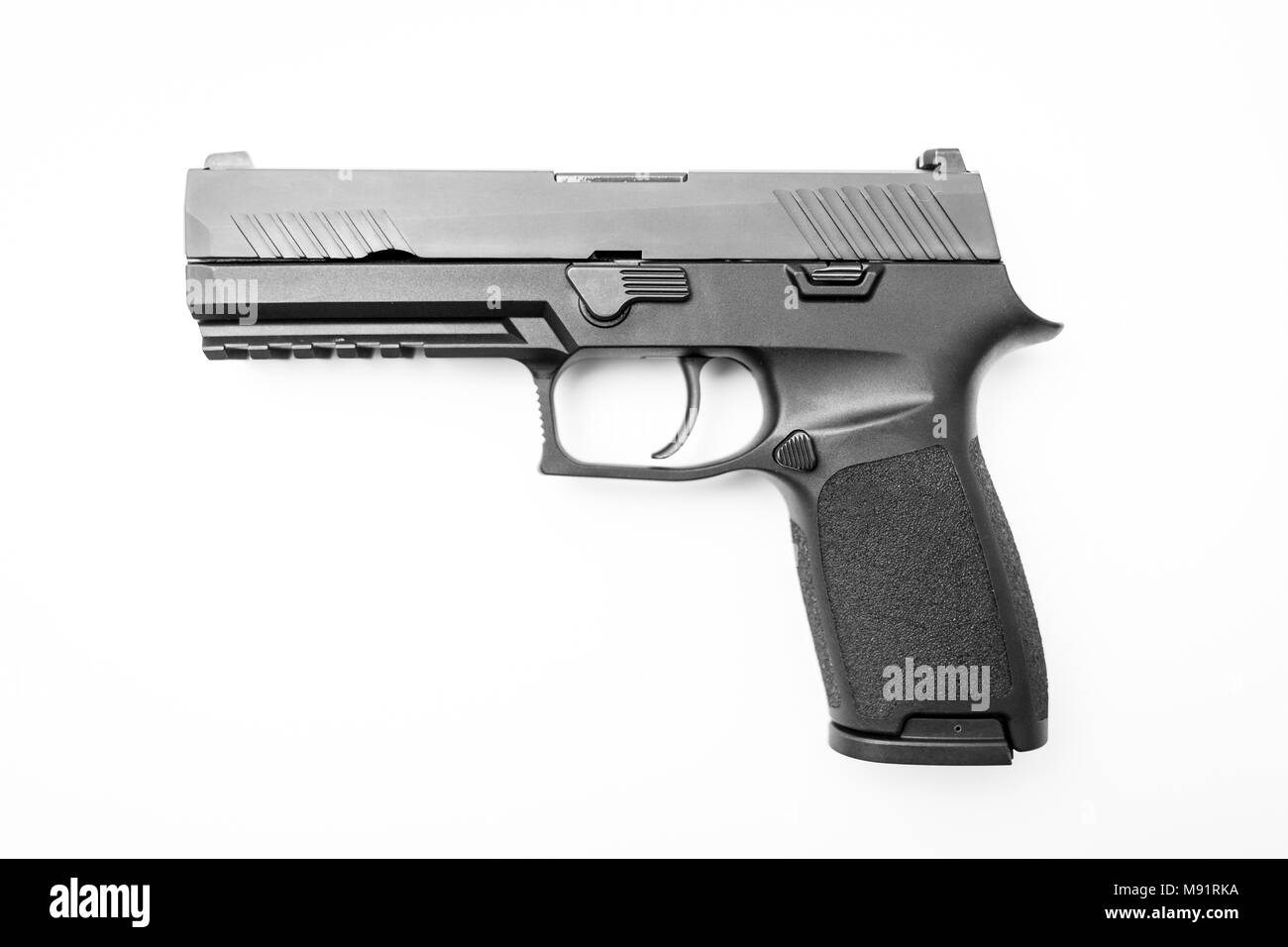 Isolierte Pistole auf weißem Hintergrund mit seitlich Stockfoto