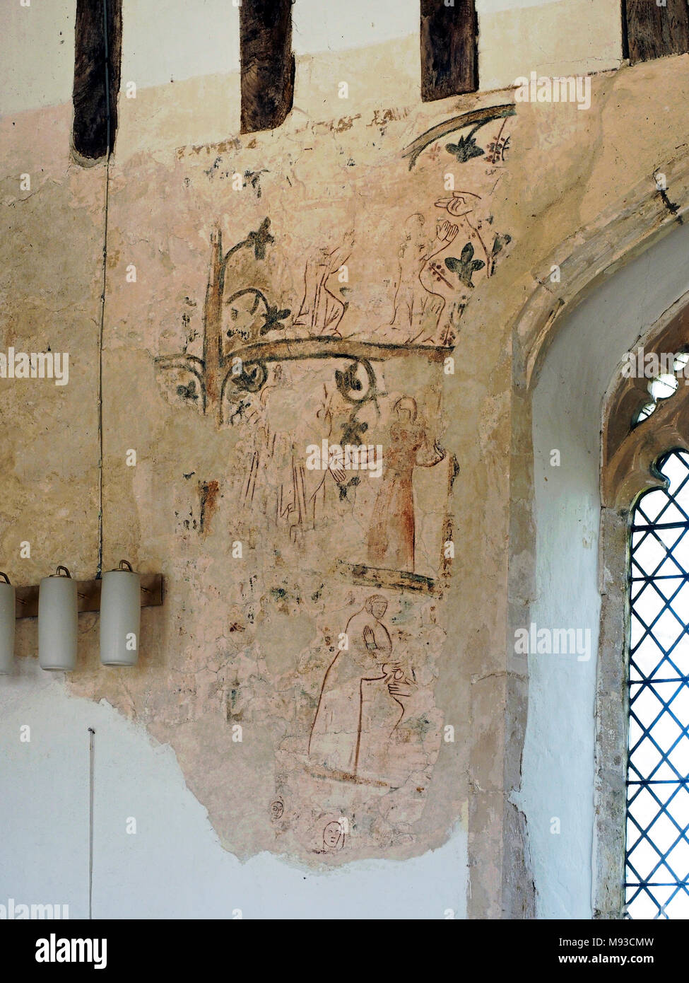 Edingthorpe Kirche, Norfolk hat seltene Gemälde aus dem 14. Jahrhundert im Norden Kirchenschiff Wand. Dies zeigt die Sieben Werke der Barmherzigkeit. Stockfoto