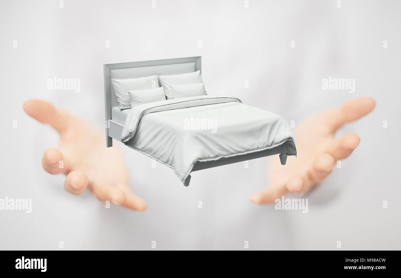 Bett auf Händen, Konzept der Traum oder Schlaf Stockfoto