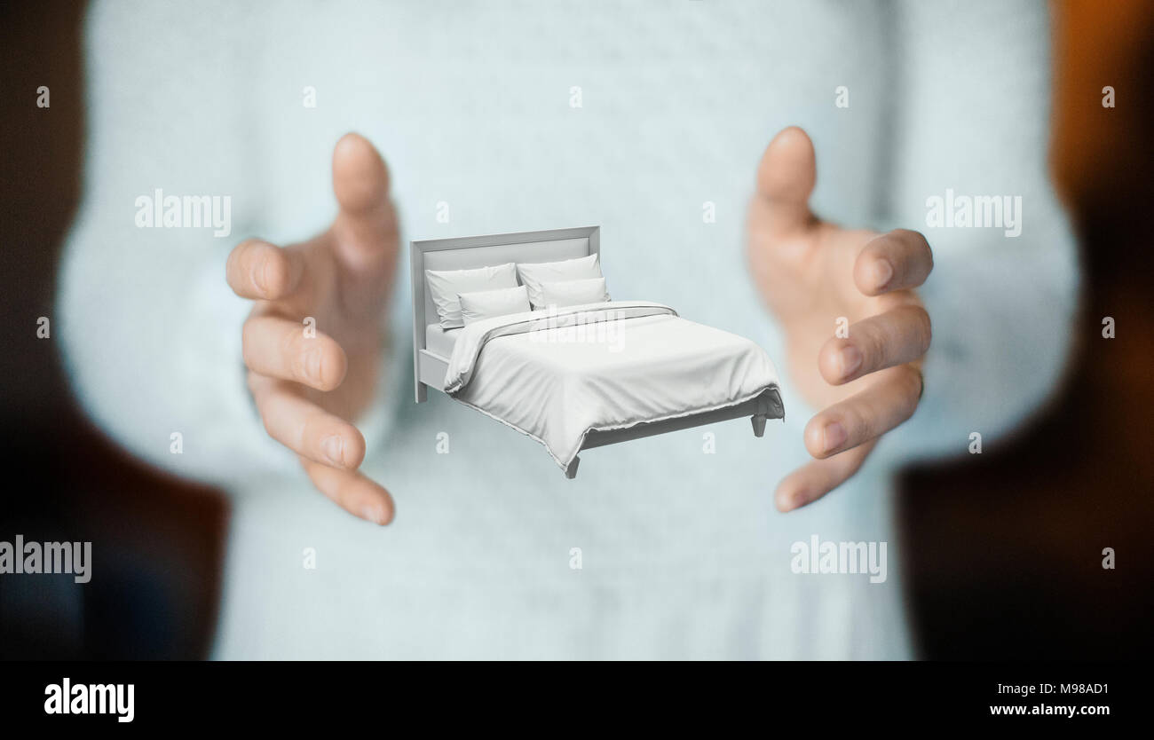 Bett auf Händen, Konzept der Traum oder Schlaf Stockfoto