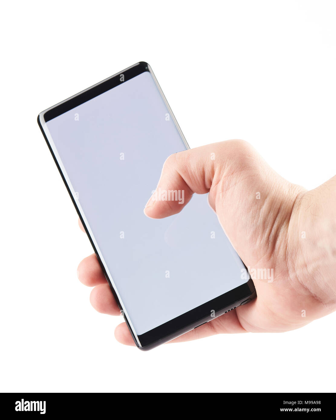 Nahaufnahme der Hand mit modernen Smartphone auf weißem Hintergrund Stockfoto