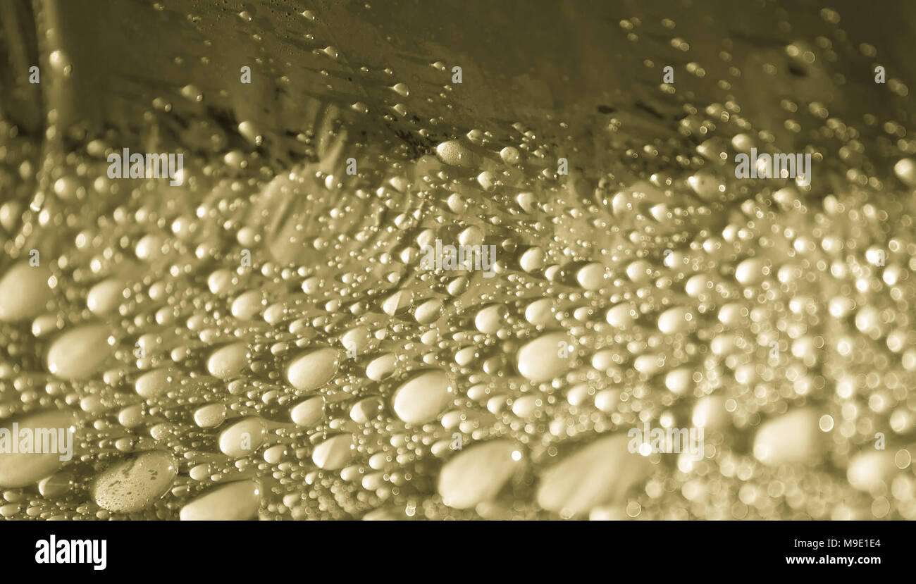 Abstrakte Pale Gold Wassertropfen Hintergrund Stockfoto
