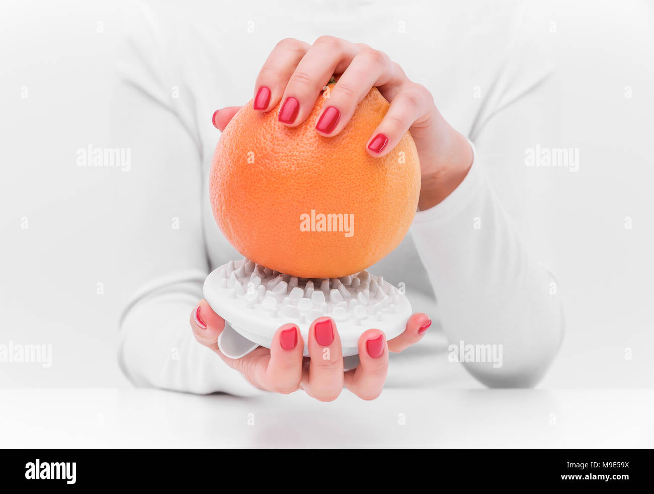 Anti Cellulite Massagegerät und orange. Stockfoto