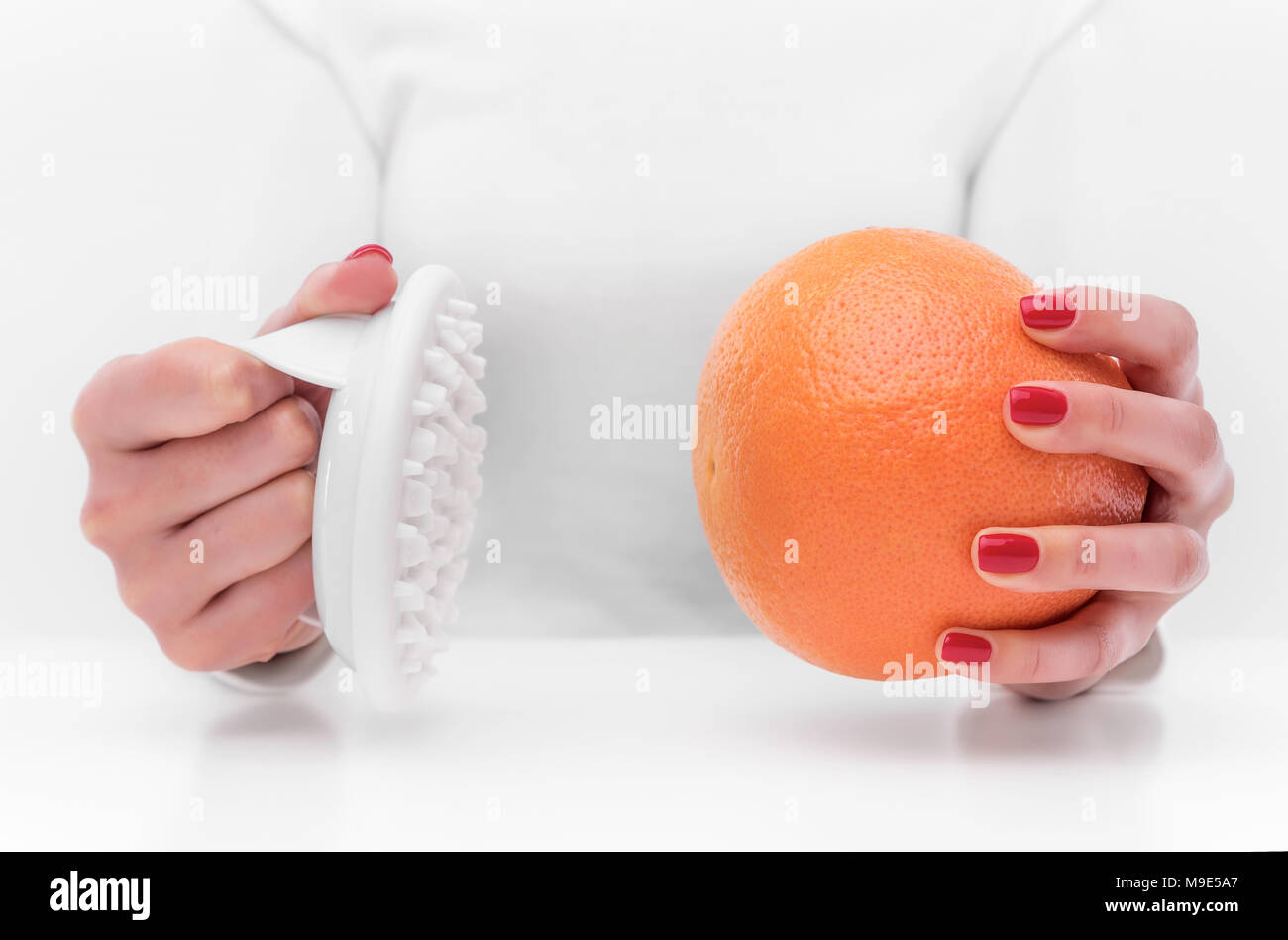Anti Cellulite Massagegerät und orange. Stockfoto
