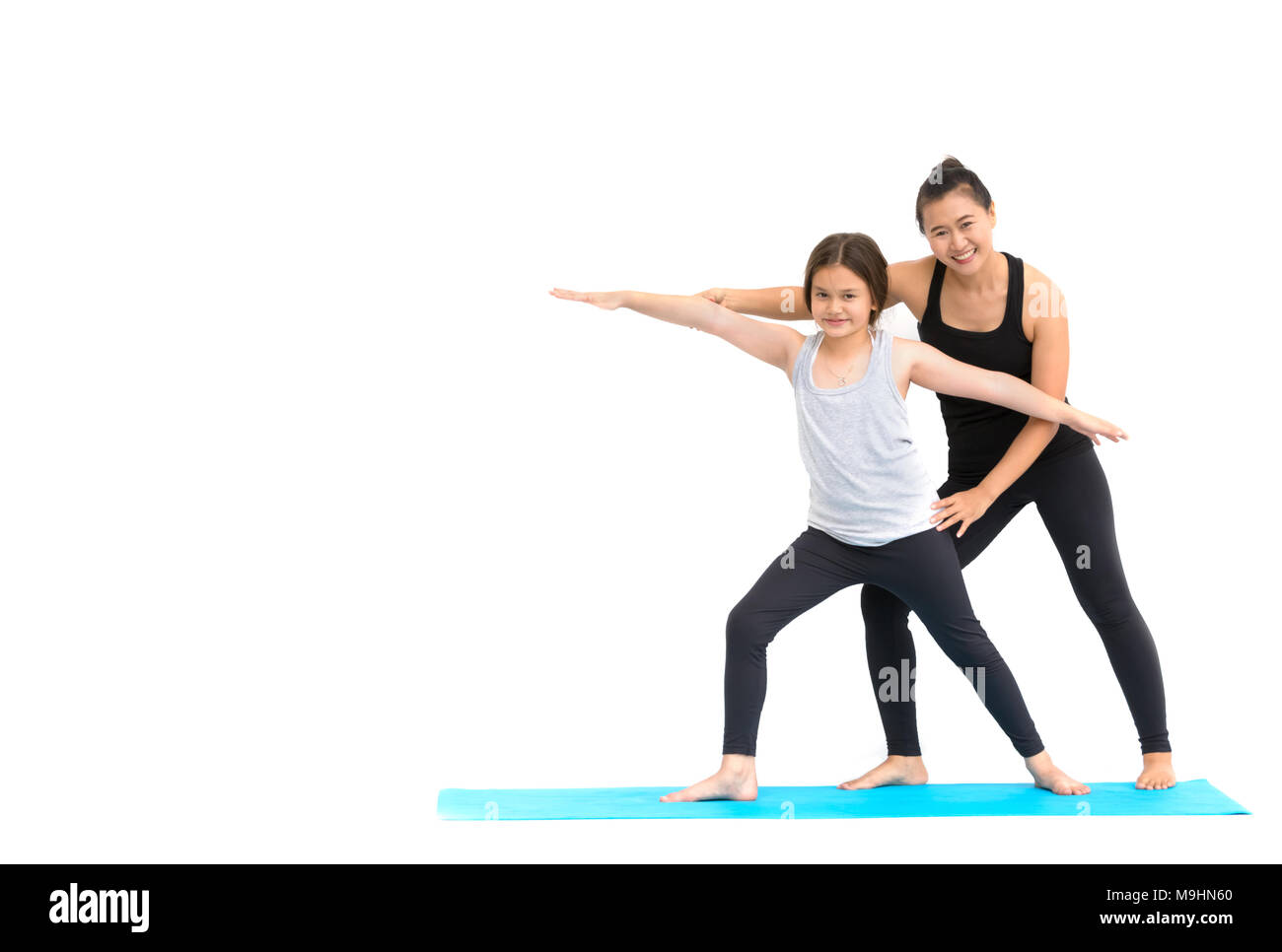 Lehrerin Ausbildung ein kleines Mädchen, Yoga Klasse Stockfoto