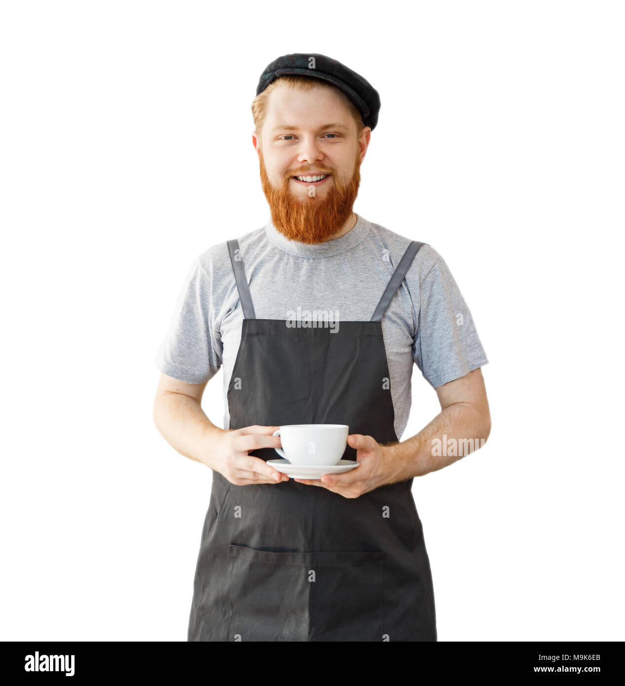 Kaffee Business Owner Konzept - Porträt der glückliche junge Bartgeier kaukasischen Barista in Schürze mit zuversichtlich Suche Wartung heißen Kaffee an Kunden im Coffee Shop. Stockfoto