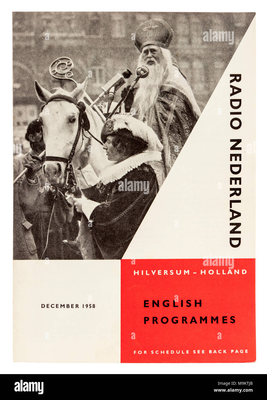 Sinterklaas und zwarte Piet (Saint Nicholas und Schwarzer Peter) auf der vorderen Abdeckung des Radio Nederland Magazin im Dezember 1958. Stockfoto