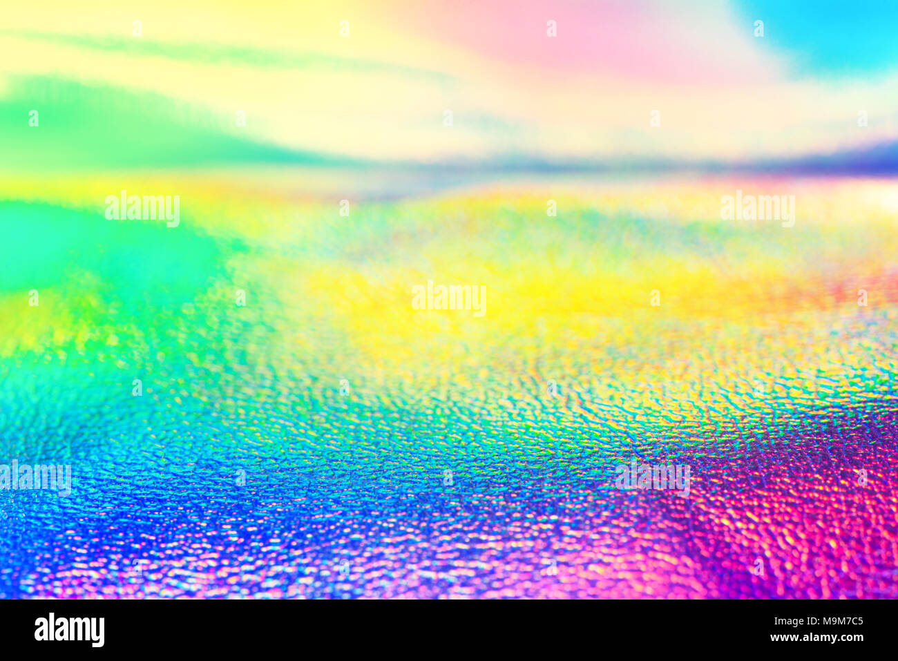 Rainbow real holografische Folie neon Textur wallpaper. Lebendige neon Textur. Trendy Hintergrund. Stockfoto