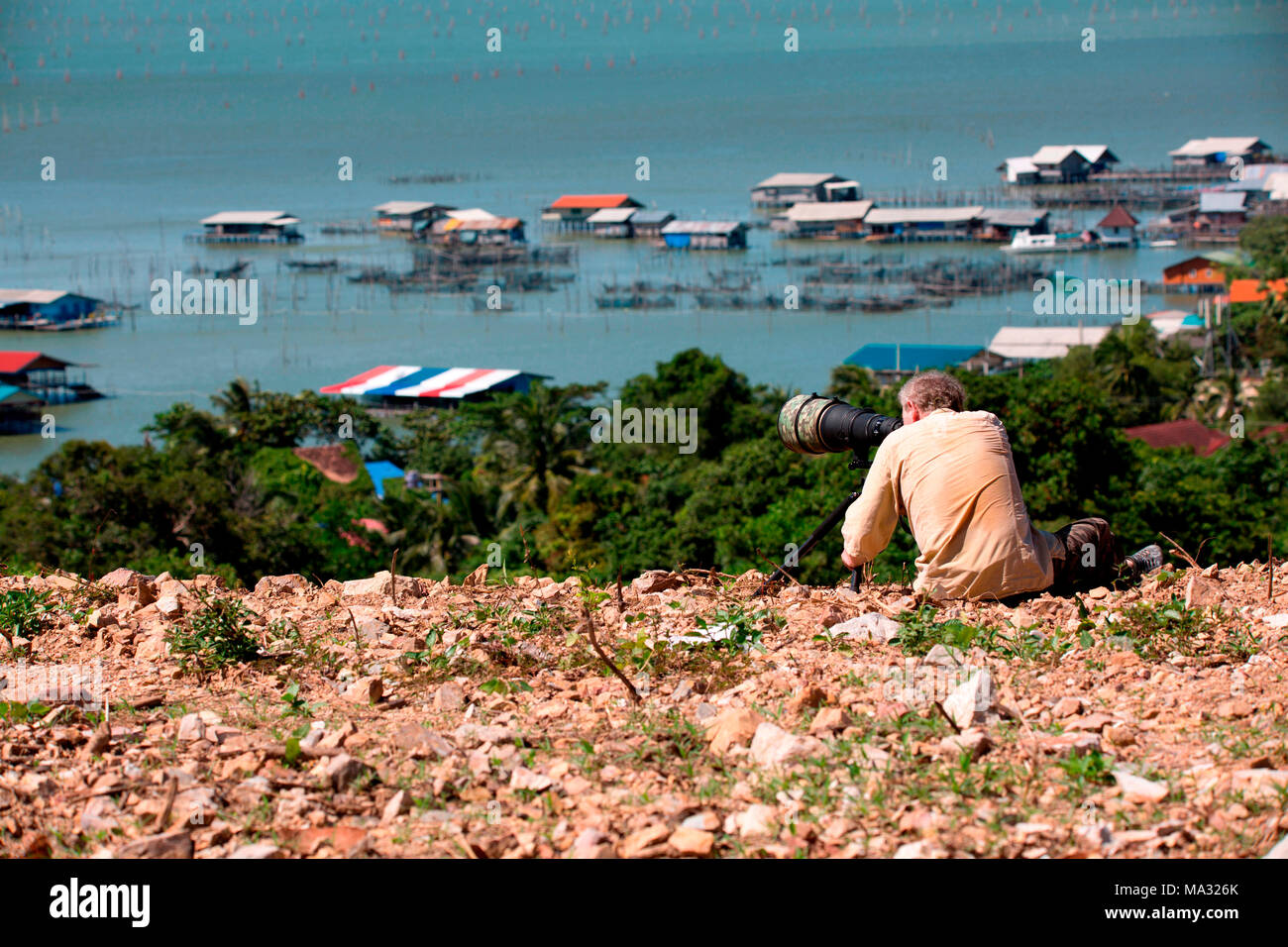 Fotograf mit einem großen Objektiv (600 mm) Stockfoto