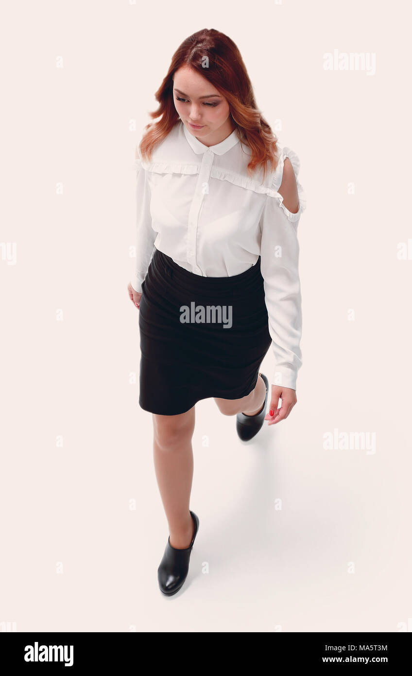 Attraktive junge Frau trägt weiße Bluse, schwarzer Rock Stockfoto