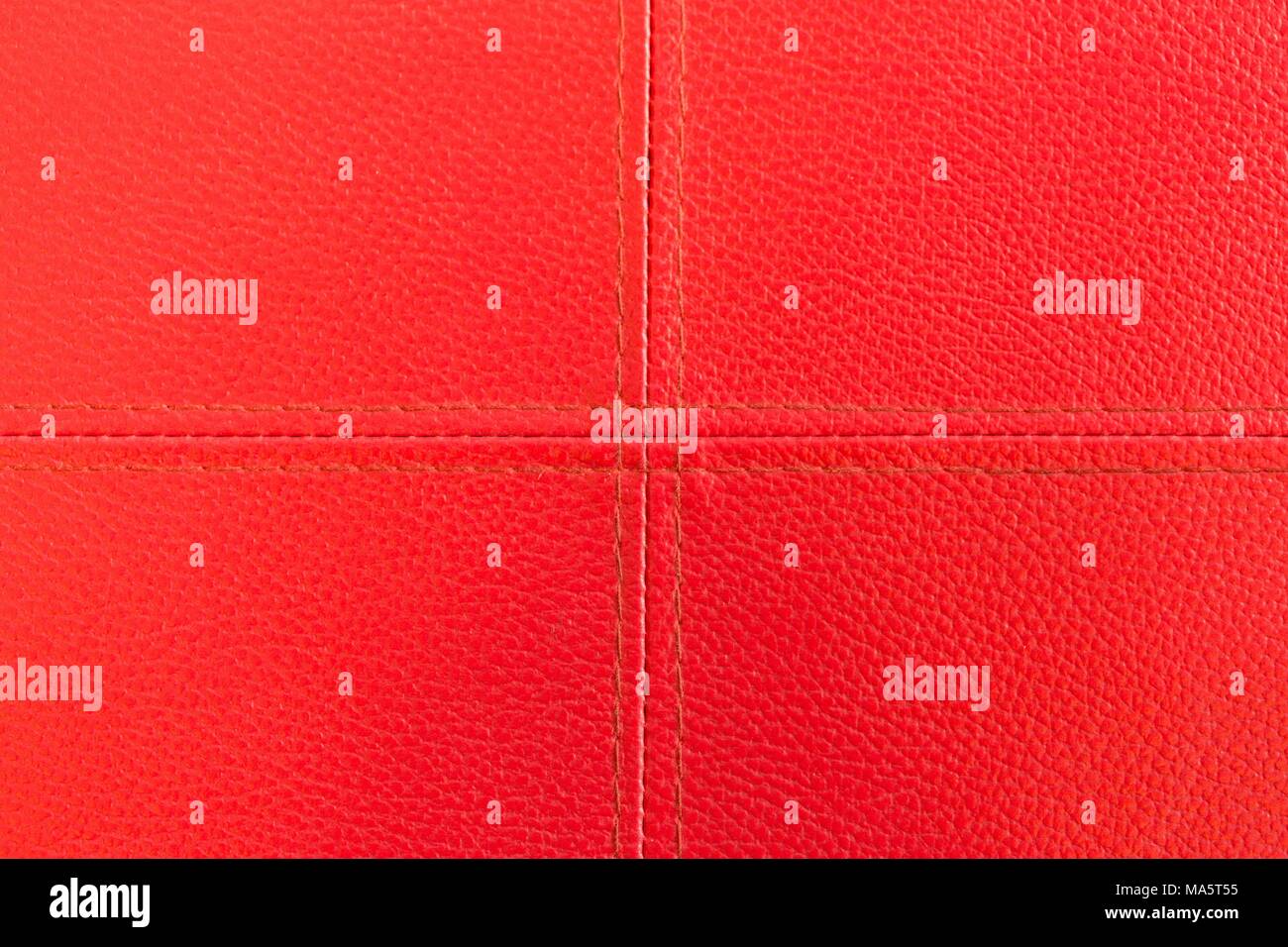 Rotes Leder mit Heftung Textur und Pluszeichen Stockfoto