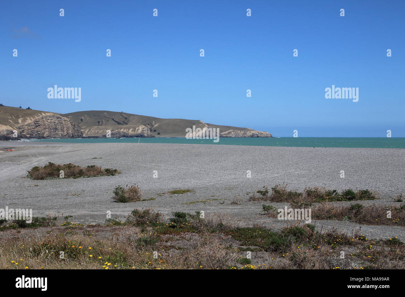 Birding, Wohnung, Neuseeland Kiesstrand in der Nähe von Christchurch auf der Südinsel, ein schönes Seascape anzeigen. Stockfoto