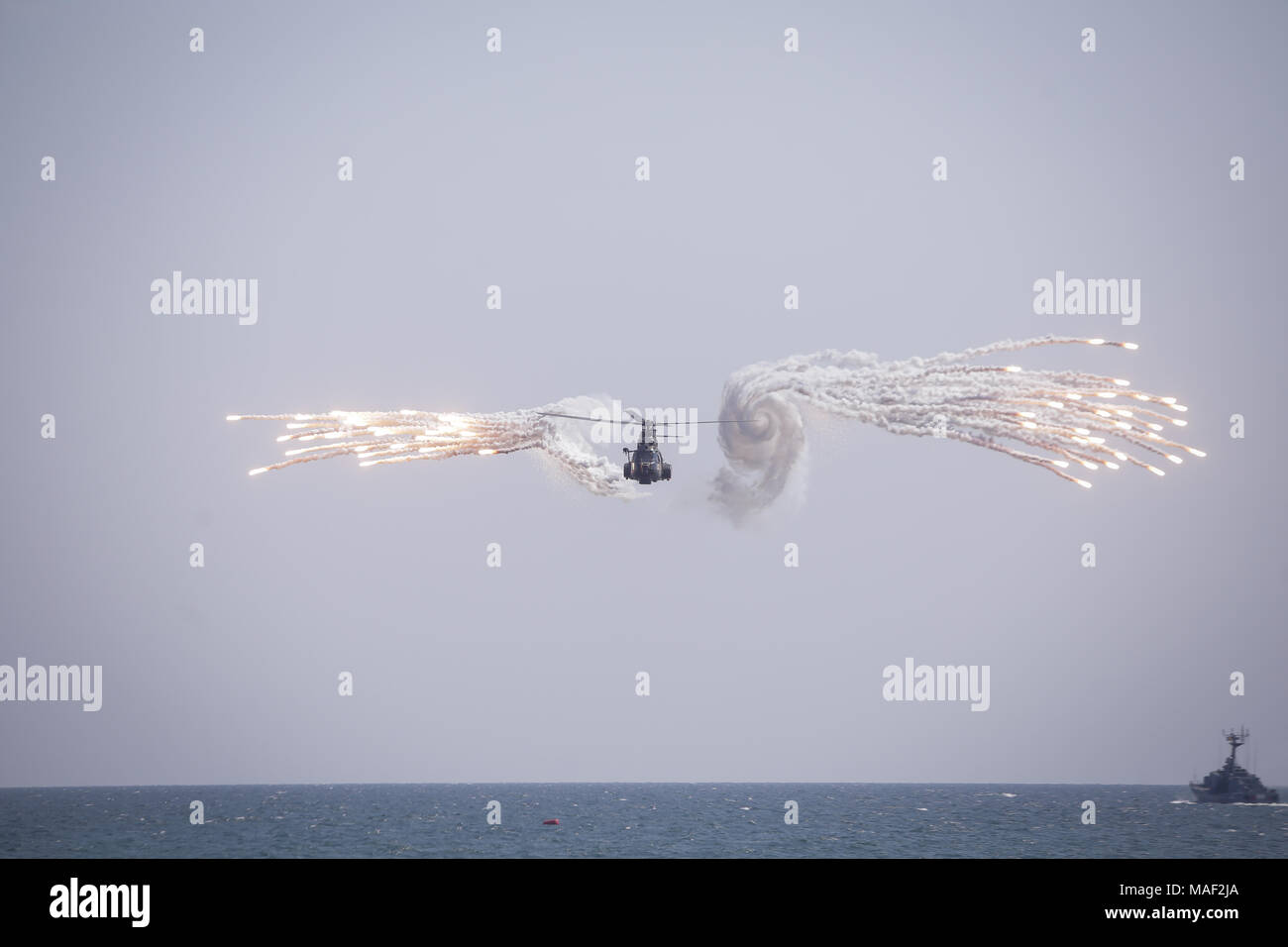 Romanian navy helicopter launches decoy flares (missile defense system) during the Romanian Navy Day Stockfoto