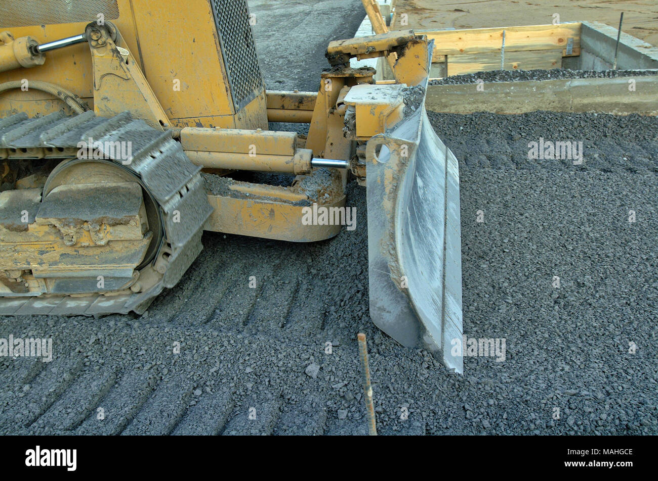 Eine Konstruktion, Bulldozer, Schotter, auf einer Straße Gebäude job Stockfoto