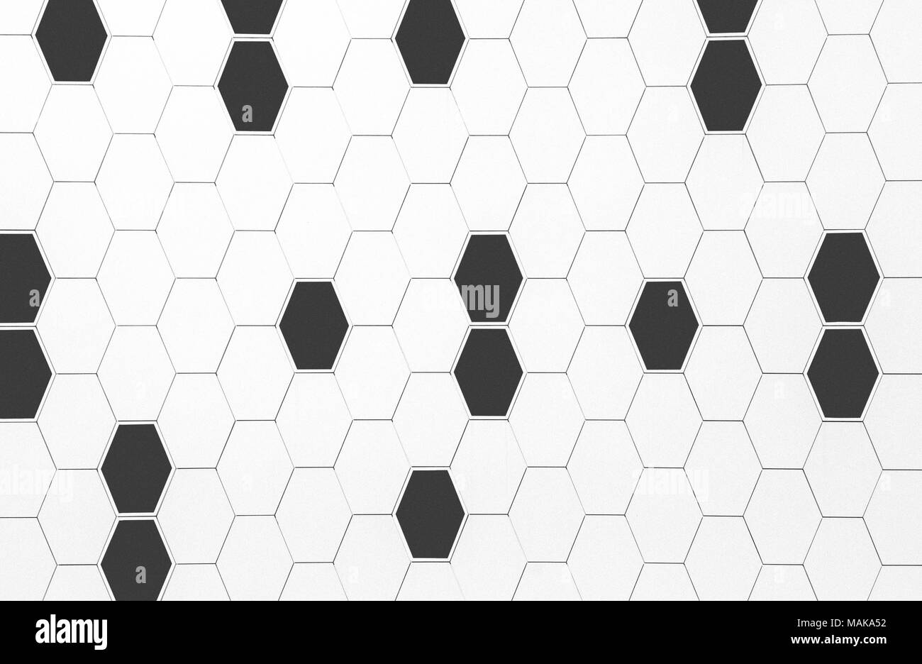 Architektonische abstrakte Wand außen Textur mit schwarzen und weißen geometrischen Hexagon Formen Stockfoto