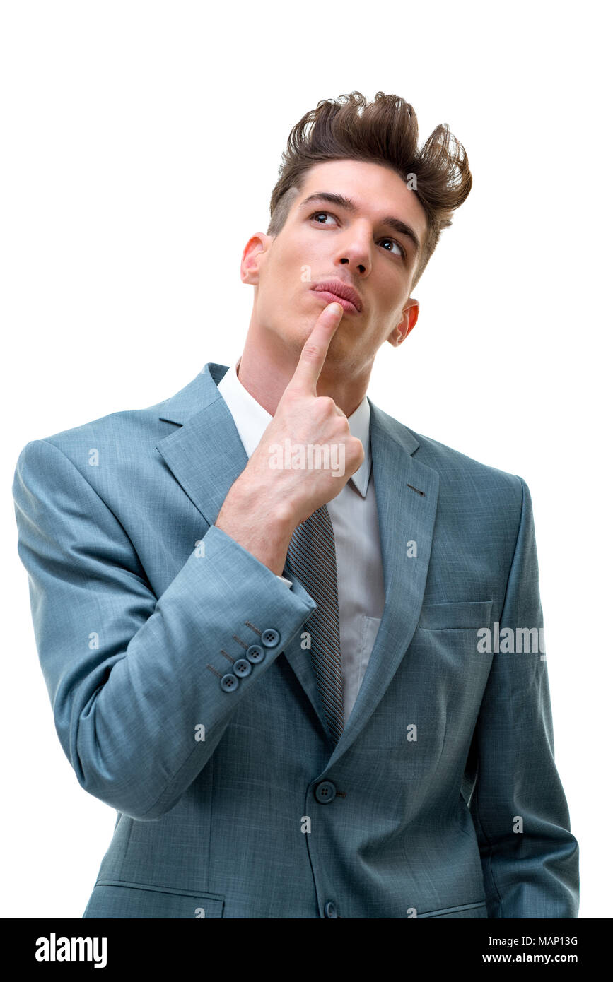 Portrait von hübscher junger Geschäftsmann in kreative Idee, einen Finger auf seine Lippen, auf weißem Hintergrund. Stockfoto