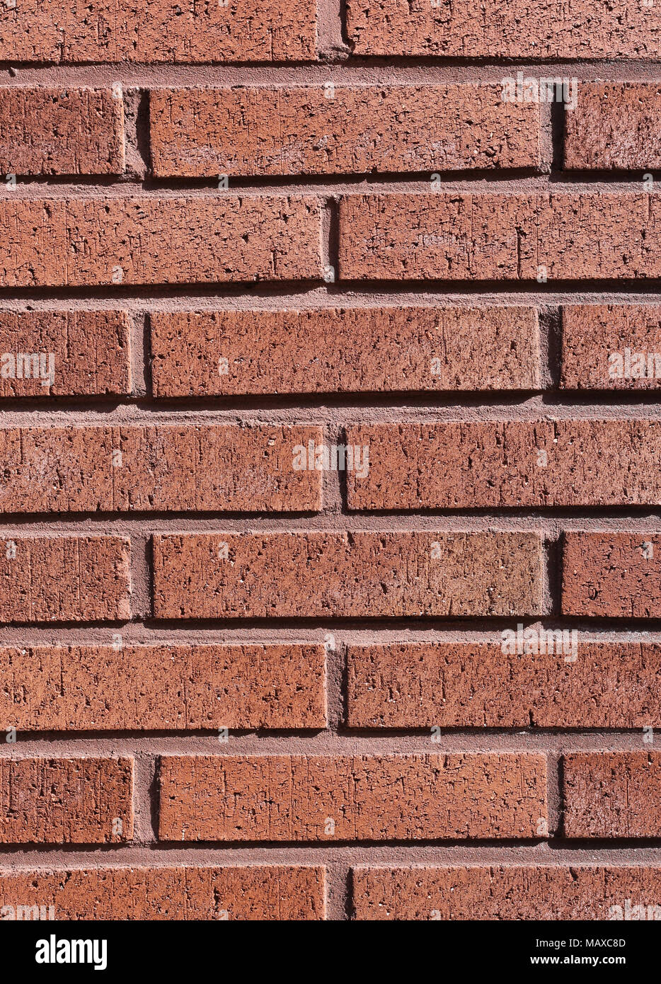 Eine Nahaufnahme einer rot/orange brick wall, dass es sehr sauber und symmetrisch. Perfekte Hintergrund oder Tapeten. Stockfoto