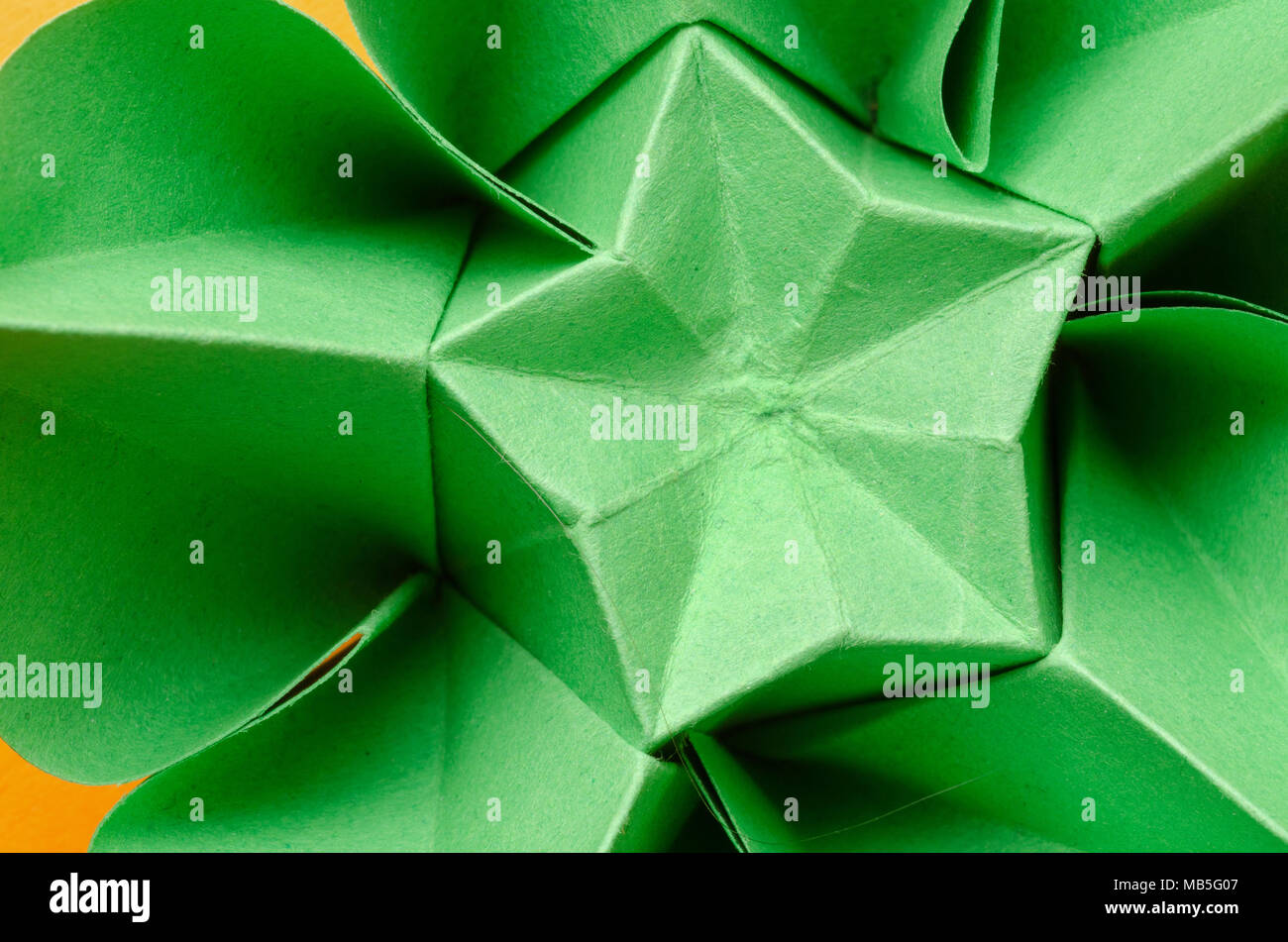 Abstrakte Nahaufnahme von einem Grünbuch origami Blume mit Stern Stockfoto