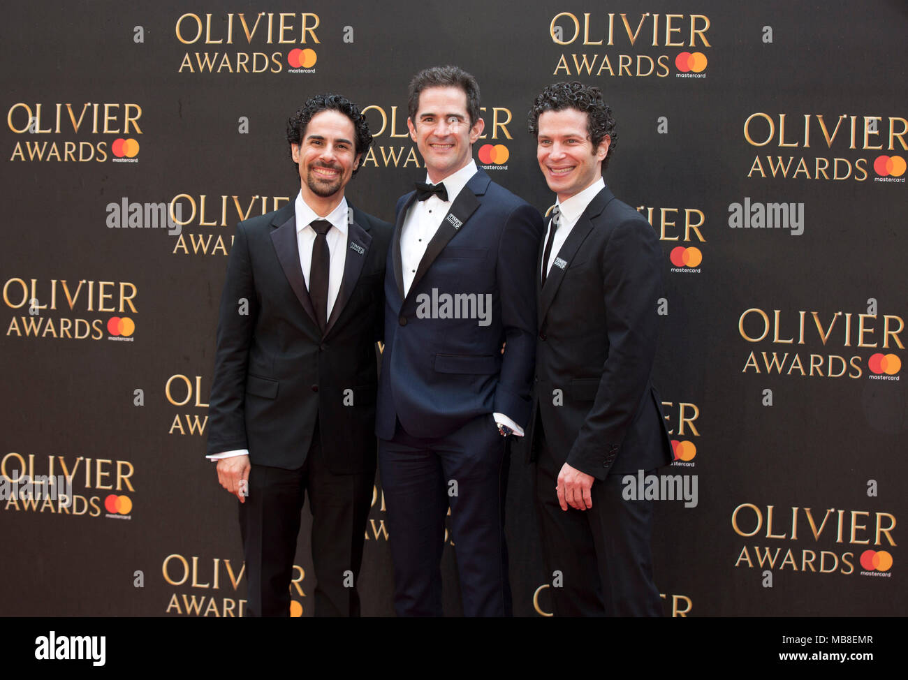 Alex Lacamoire, Links, Andy Blankenbuehler und Thomas Kail ankommen für die Olivier Awards in der Royal Albert Hall in London. Stockfoto