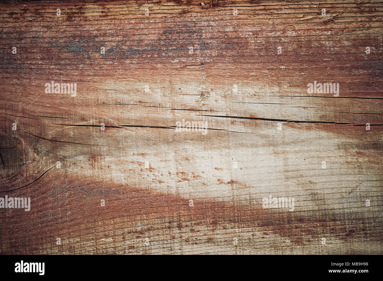 Holz Textur in warmen goldenen und braunen Tönen. Alte ländliche Holzwand, detaillierte plank Zaun Foto Hintergrund. Natürliche Holz- Gebäude. Stockfoto