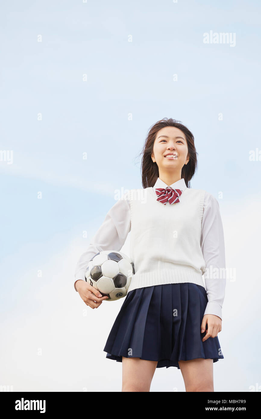 Süße japanische High School Student in einem Stadtpark Stockfoto