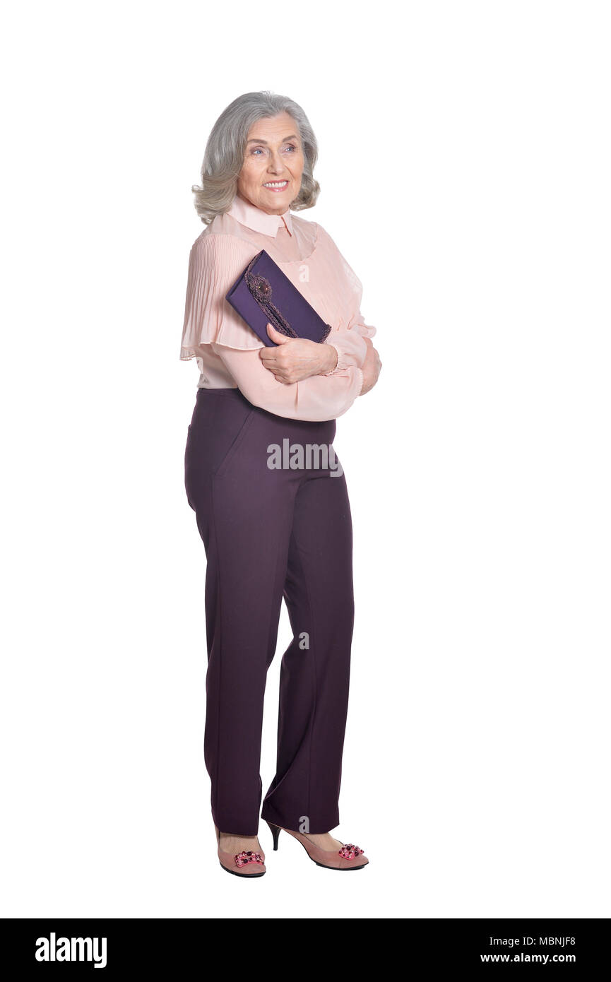 Gerne ältere Frau mit Handtasche Stockfoto