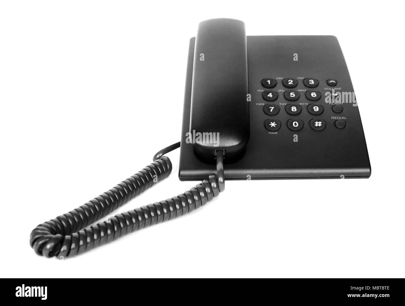 Schwarzen Bürotelefon isoliert auf weiss Stockfoto